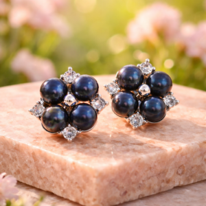 Stud earring with four black freshwater pearls.