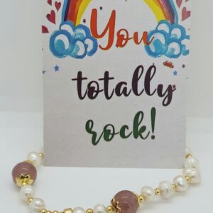 Freshwater pearl bracelet with pink agate stone and mother of pearl.