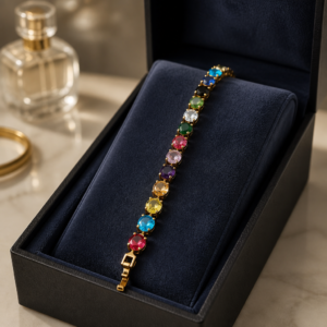 Multi-colored cubic zirconia set in 18k rose gold-plated tennis bracelet.